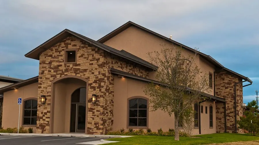 The Amarillo Dental Associates building on Van Winkle Drive, with its stone and stucco walls.