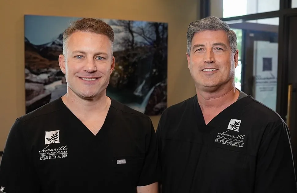 Dr. Ryan D. Hyde and Dr. Ryan A. Street in the practice's black scrubs.